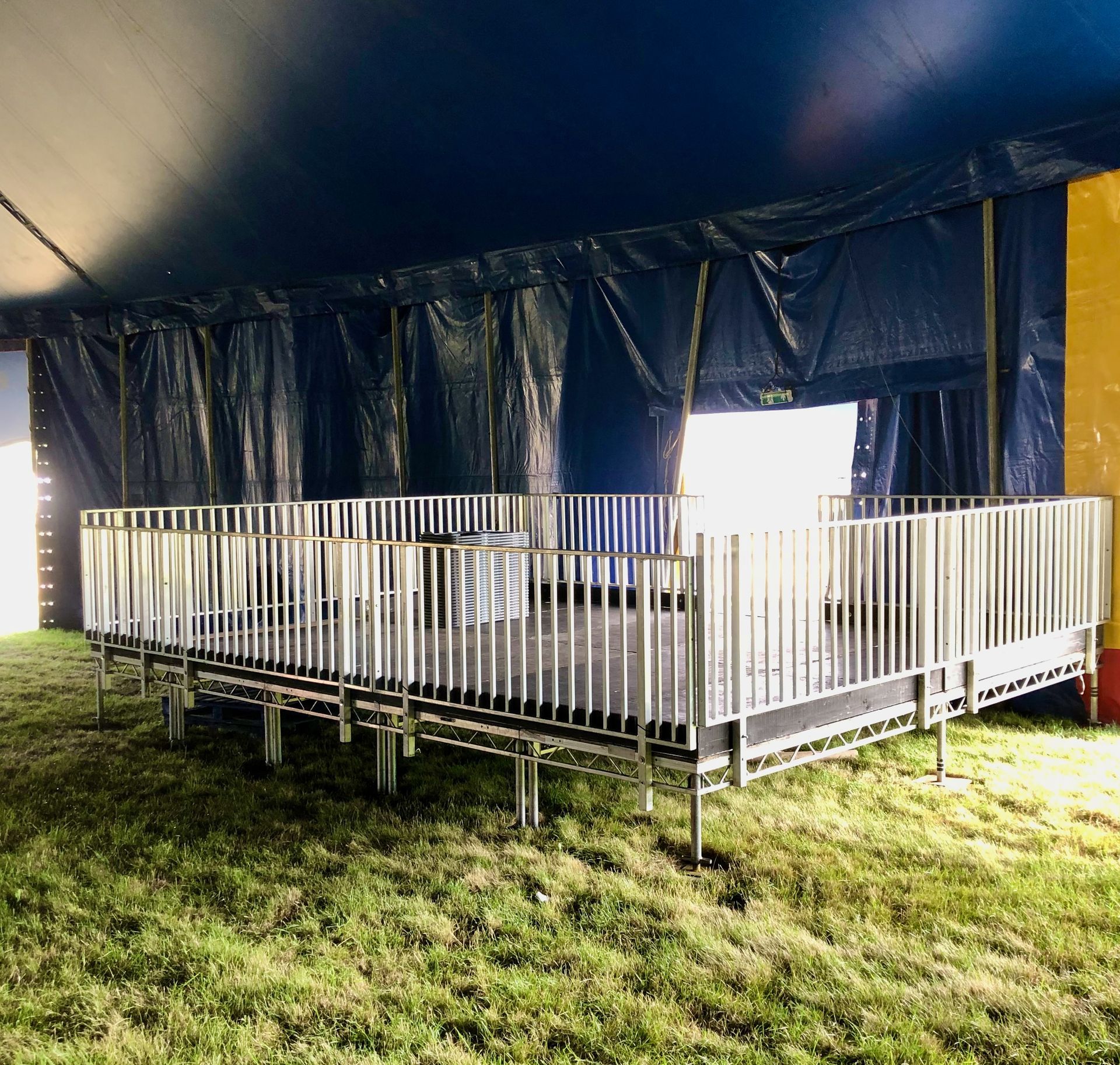 A large tent with a disability access platform in the middle of it