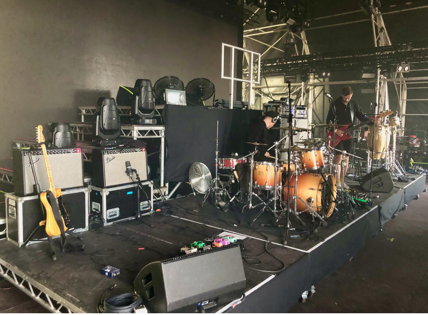 A drumkit set up on a mobile drum riser, ready to go on stage