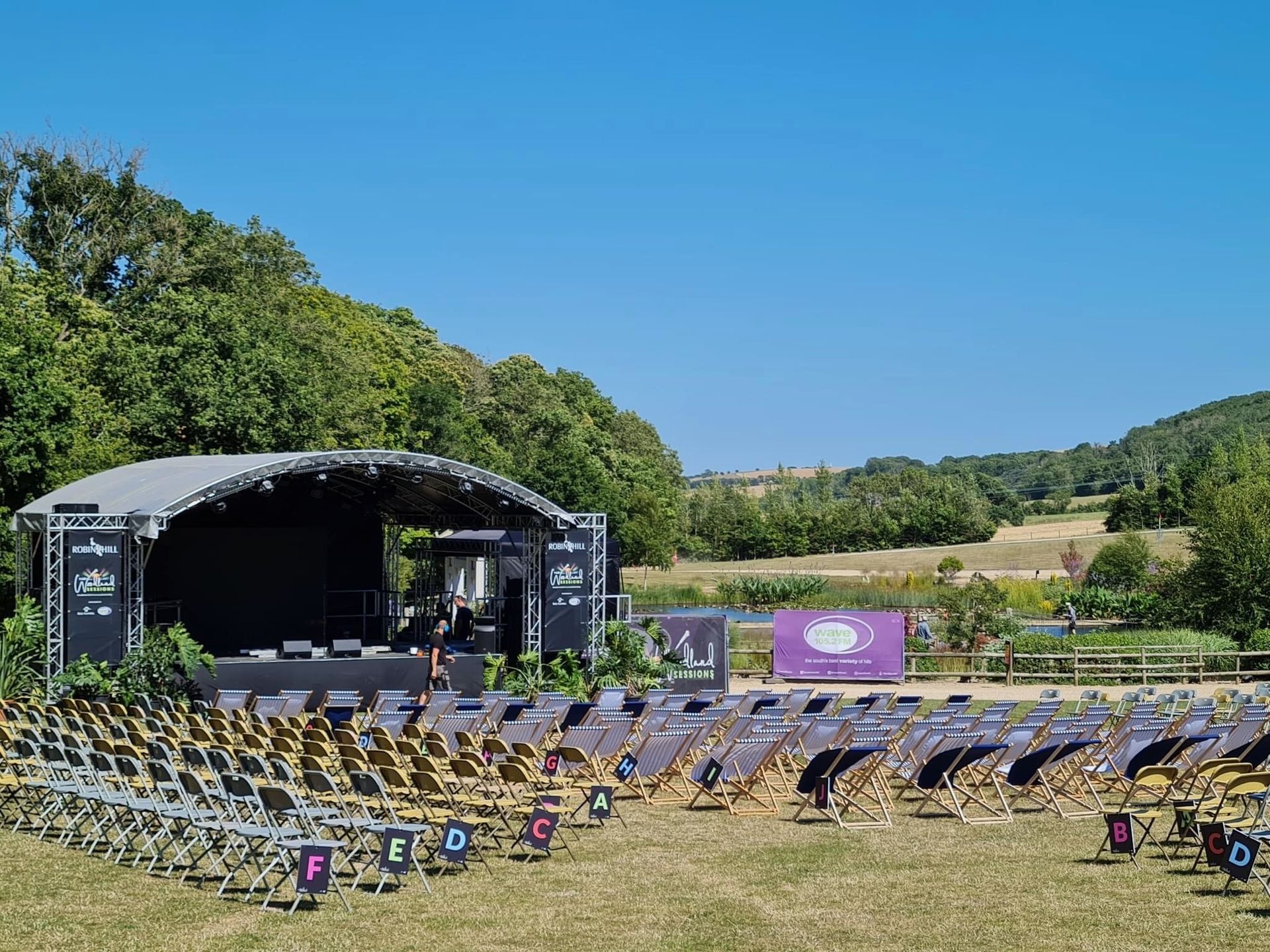 A large stage with a lot of chairs in front of it.
