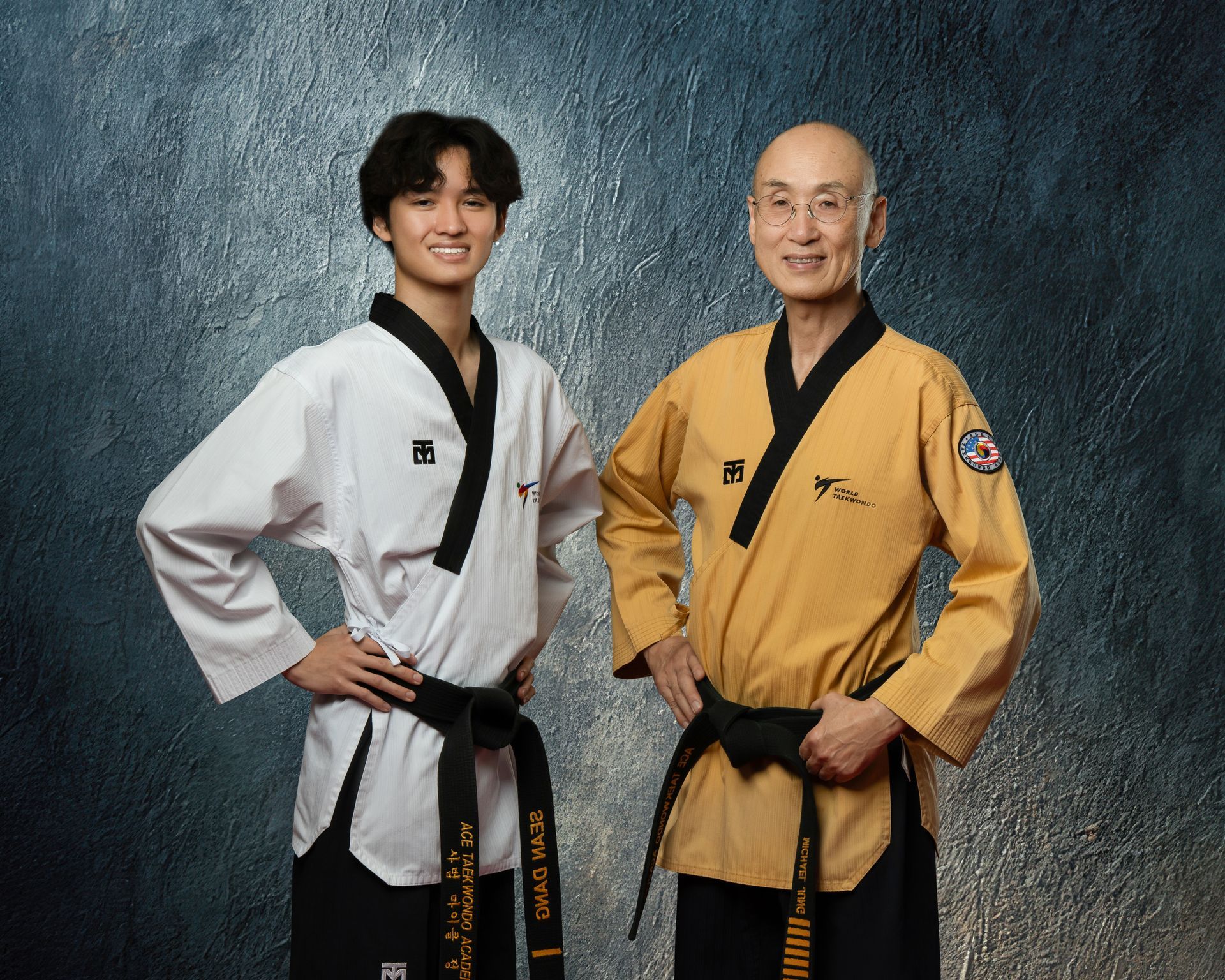 3 Taekwondo kids posing attack stance.