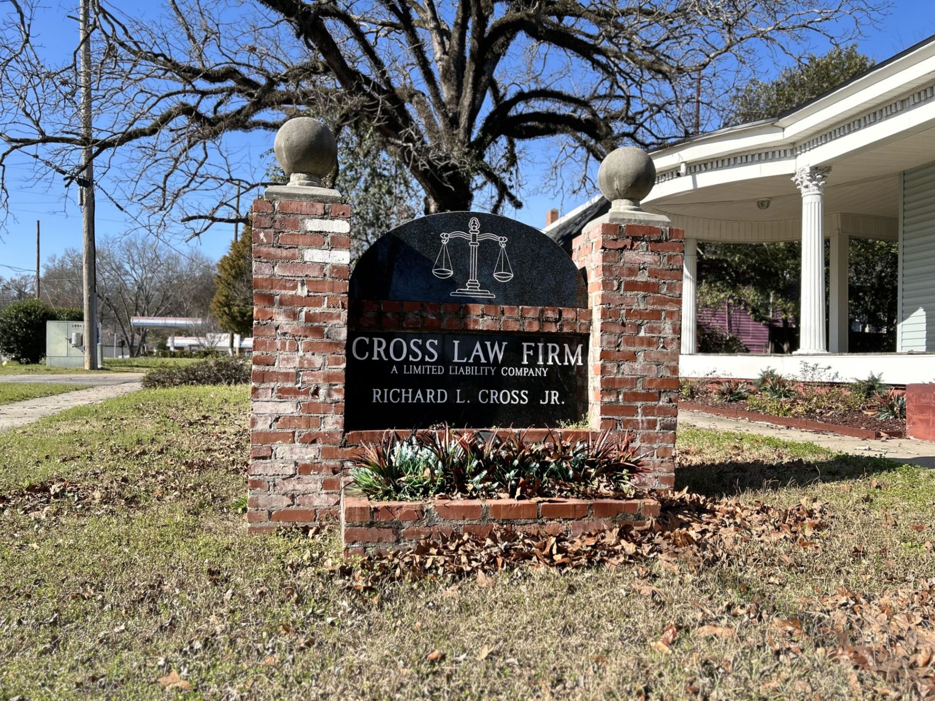 Cross Lane Fire Department sign in front of a brick building with white columns