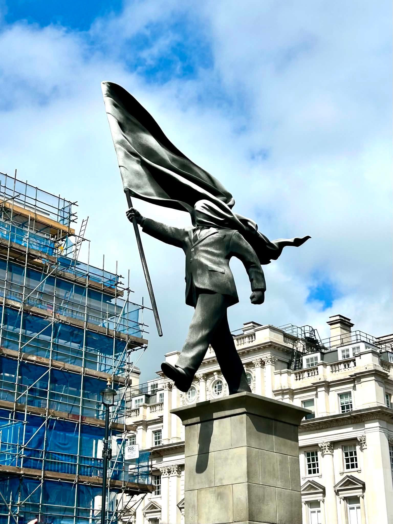 Banksy's sculpture in Waterloo Place, London, illustrating the artist whose trademark and copyright 