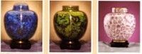 three urns are sitting next to each other on a table .