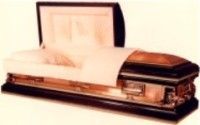 a black and gold casket with the lid open on a white background .