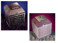 two urn vaults are sitting next to each other on a table .