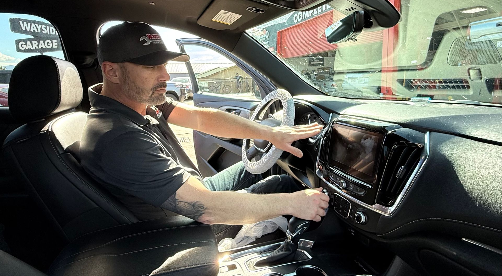 Technician testing car AC system for repair at Wayside Garage in Seaside CA