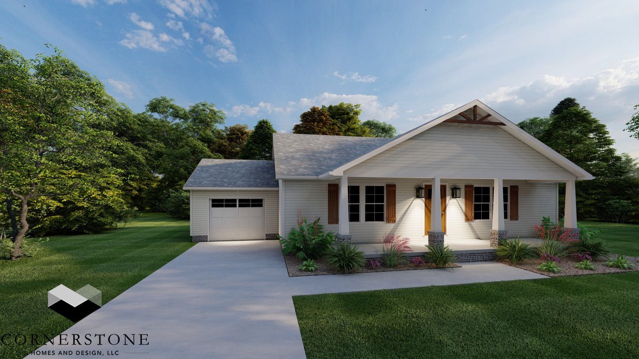 A white house with a garage is surrounded by trees and grass.