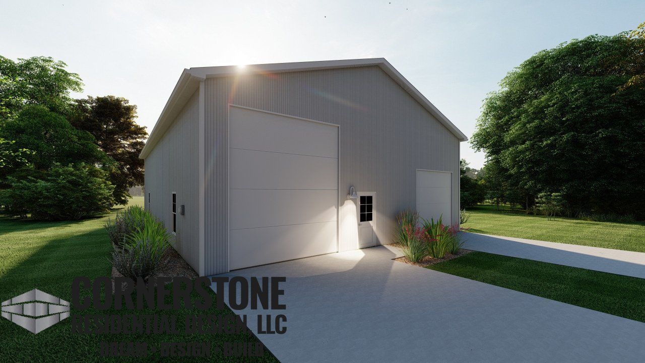 A white garage with a large door is sitting in the middle of a grassy field.