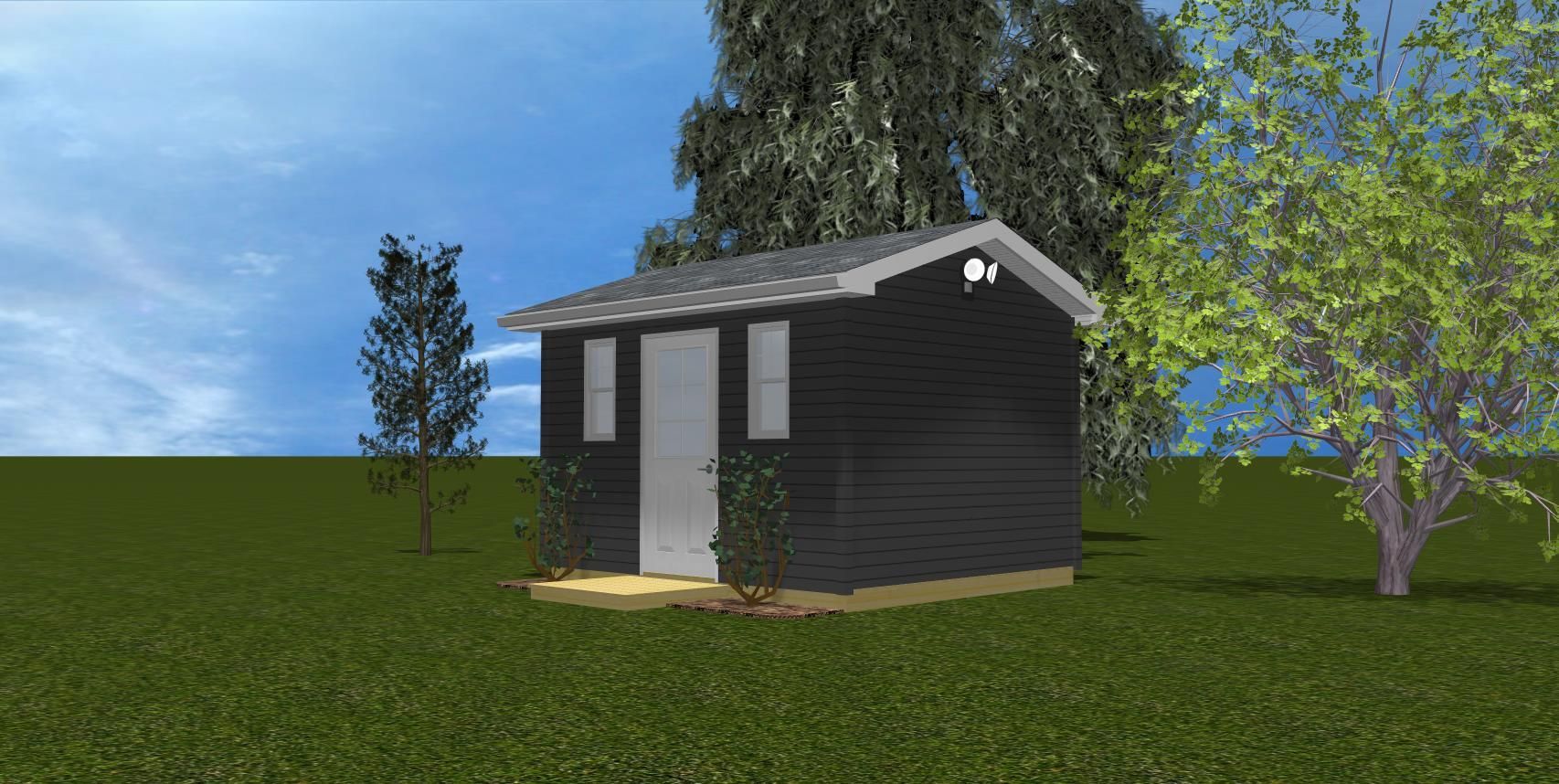 A small black shed is sitting in the middle of a grassy field.