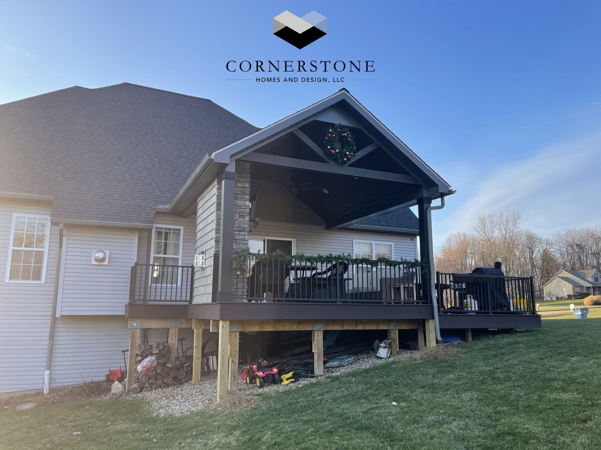 A house with a large deck and a covered porch