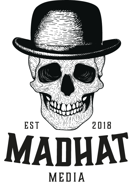 Skull wearing a black bowler hat above bold “Madhat Media” text, with “EST 2018” on either side