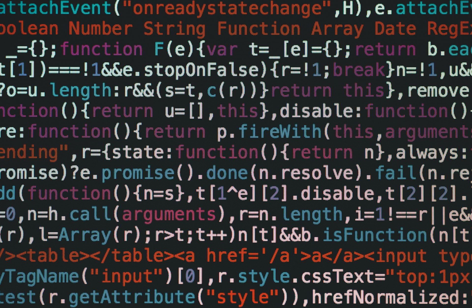 Close-up of code in multicolored text on a dark screen, resembling a programming editor.