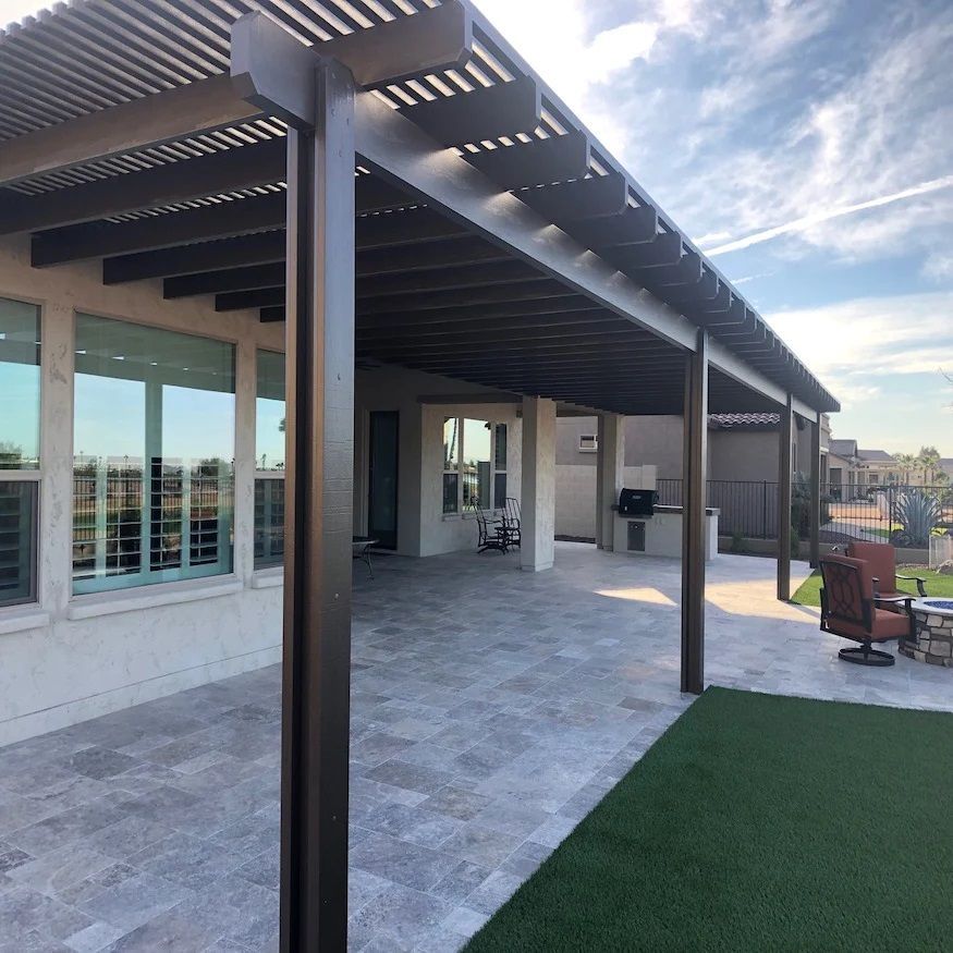 Aluminum pergola in bronze color attached to a home in Cypress, TX