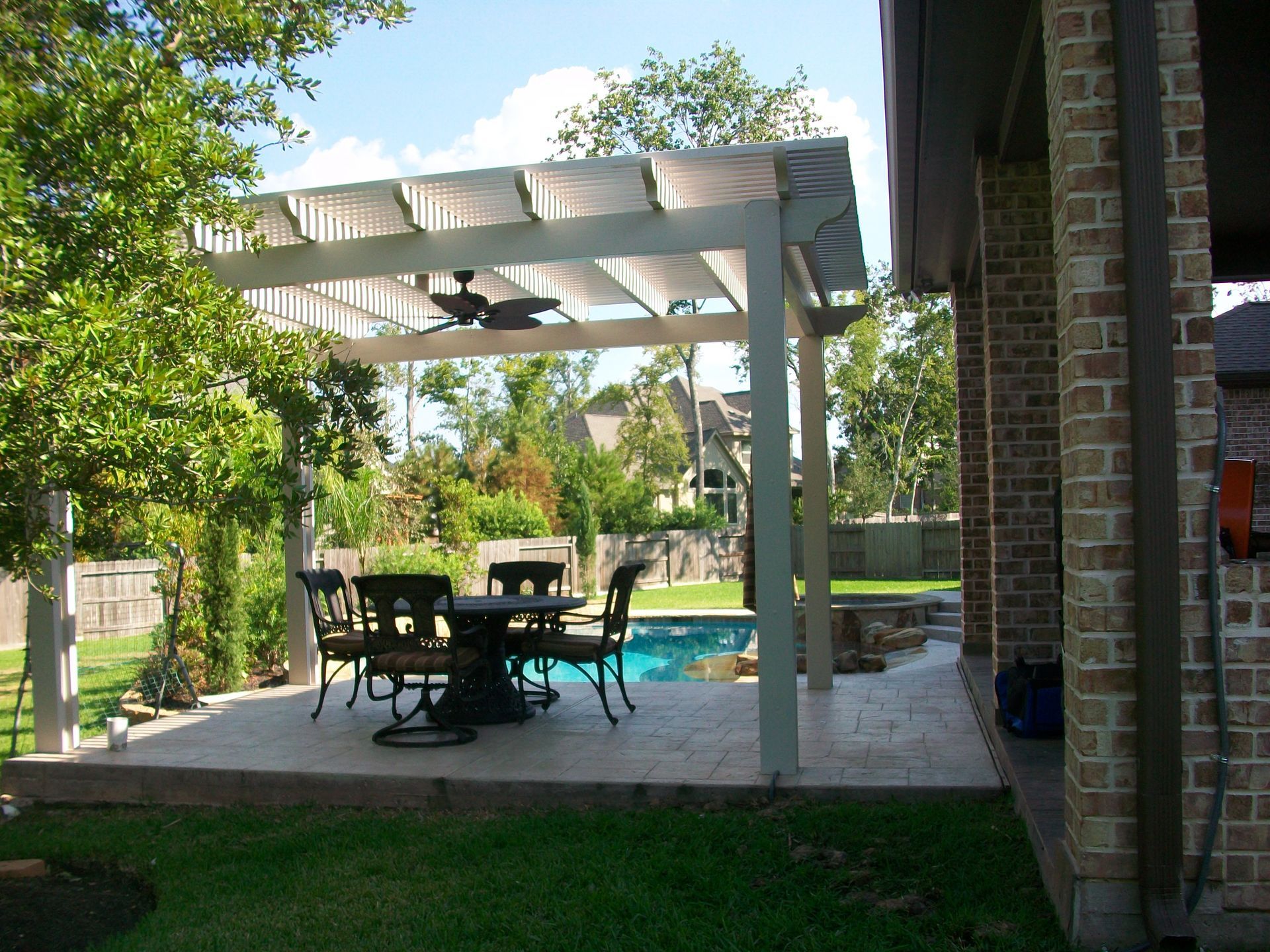 A custom-built patio cover in Houston, designed for optimal shade and weather protection.