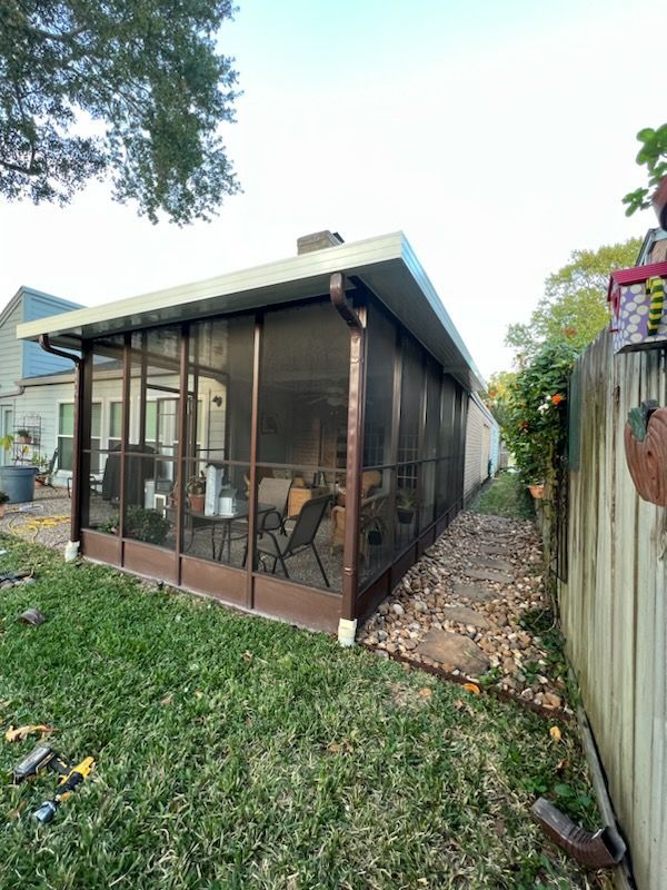 Allergy-protected patio enclosure in Channelview, TX with sealed mesh walls for pollen control.