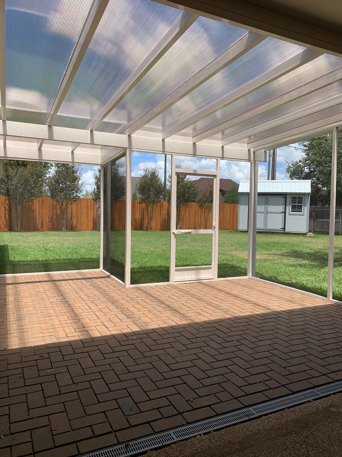 Houston patio enclosure with concrete flooring and insulated roof