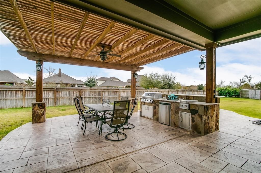 Shade arbor structure near a backyard pool in Fulshear TX