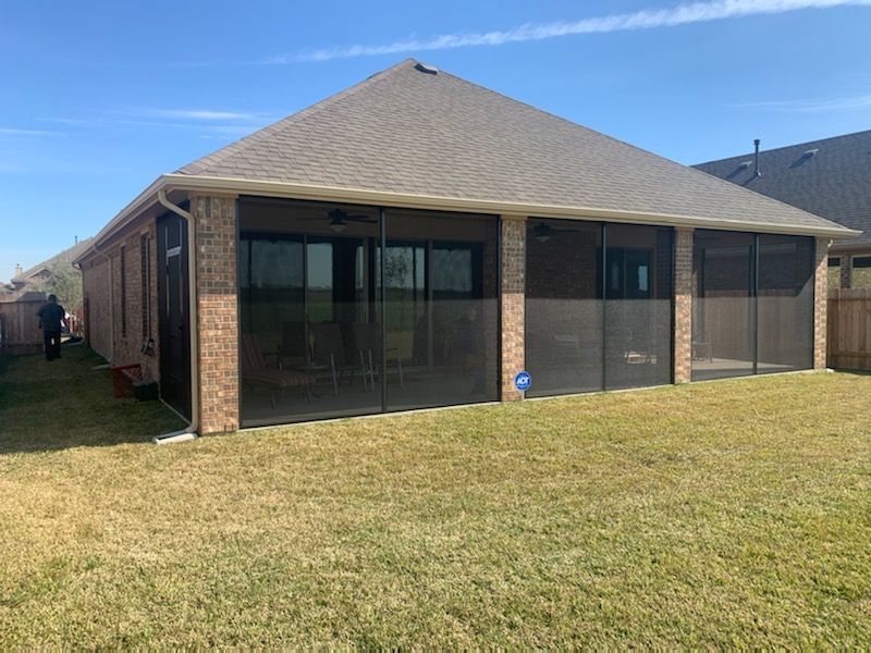 Bronze patio screen enclosure with double entry and ceiling fan