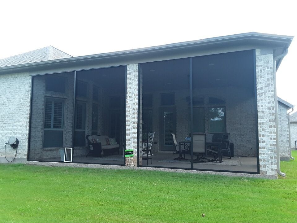 Tomball patio screen enclosure with brick columns and bug-resistant mesh