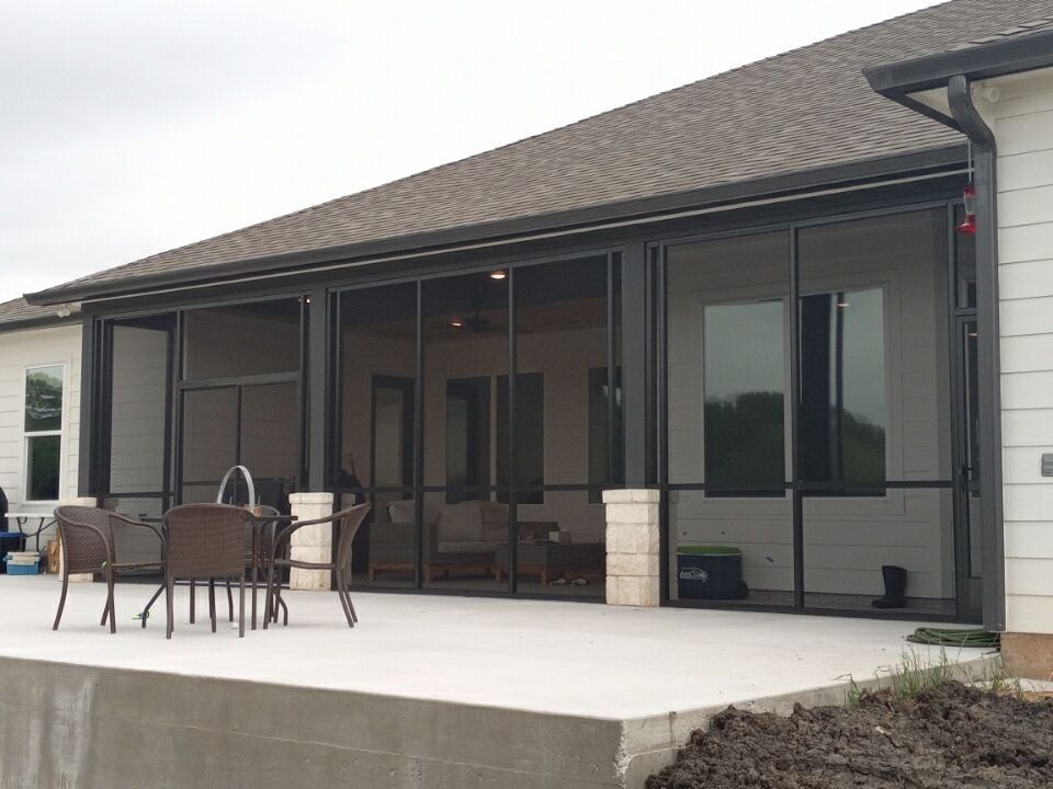 Houston patio enclosure with brick base and durable mesh