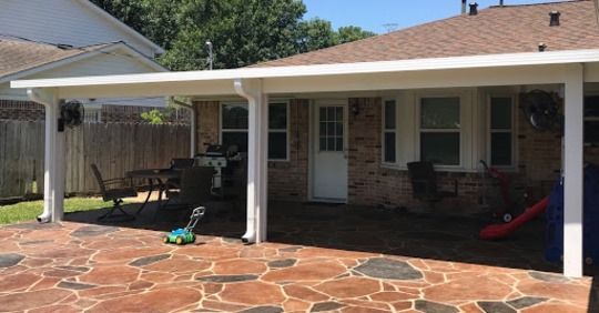 Houston, TX patio cover seamlessly attached to home for shade, weather protection, and extended outdoor living.