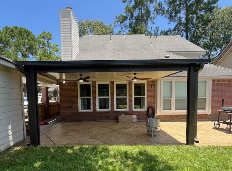 Custom insulated patio cover in Houston with windstorm-certified engineering.