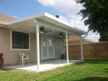 Outdoor patio cover in Richmond, TX with built-in seating and stylish pergola extension.