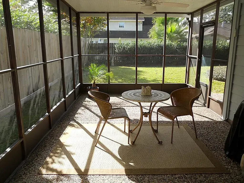 Richmond patio enclosure with black aluminum frame and mesh walls