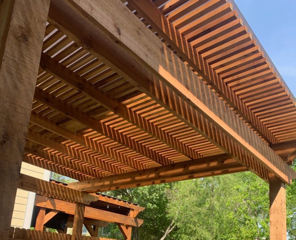 A custom pergola designed to withstand high winds in Conroe, TX.
