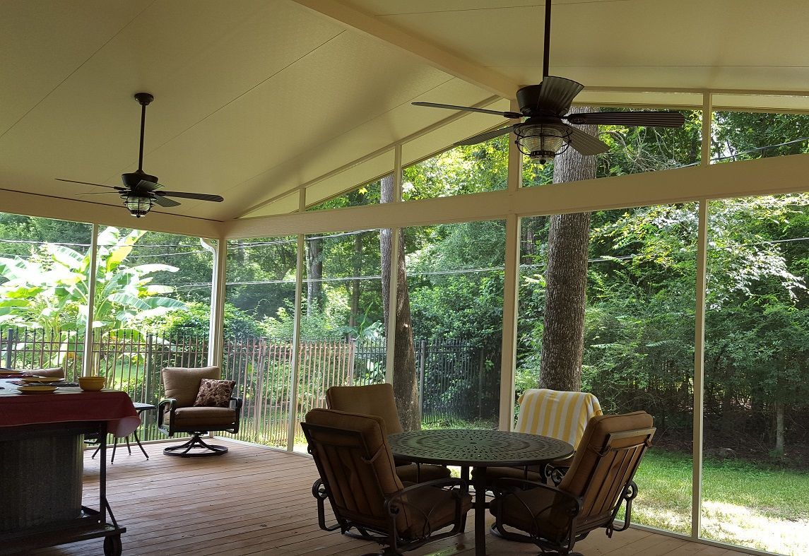 Custom screen enclosure in Katy TX with aluminum frame and ceiling fan