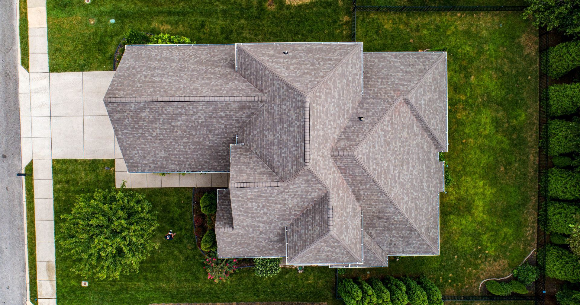 Aerial view of a newly installed gray-roof.