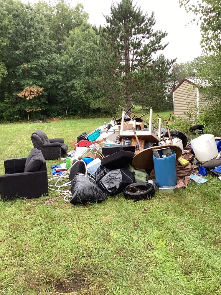 debris pile includes appliances, furniture and other junk removal items