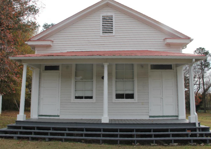 Chatsworth School Museum historic white wooden building with red roof and front porch.