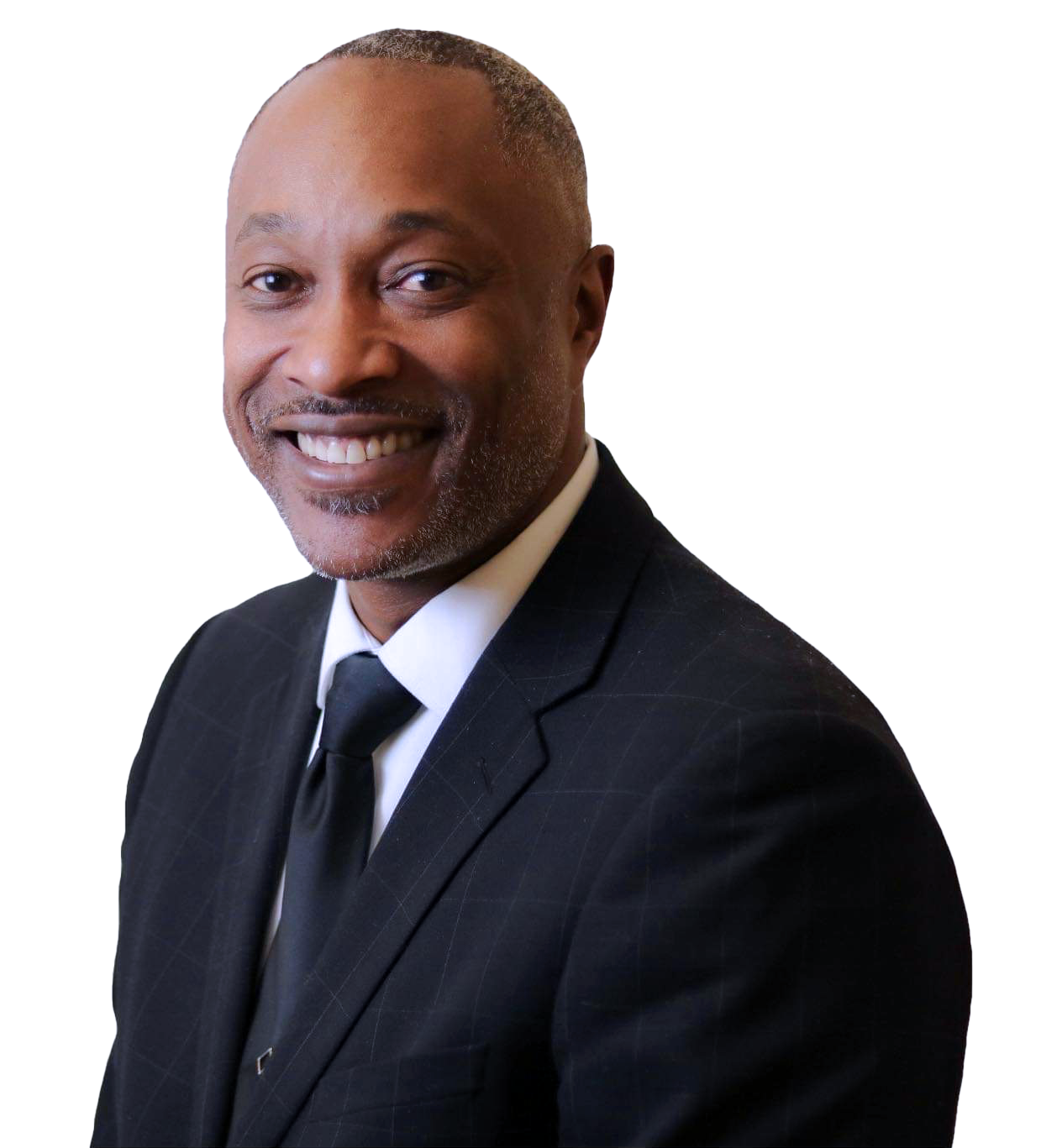 Pastor Paul D. Flowers Sr. in a suit and tie is smiling for the camera