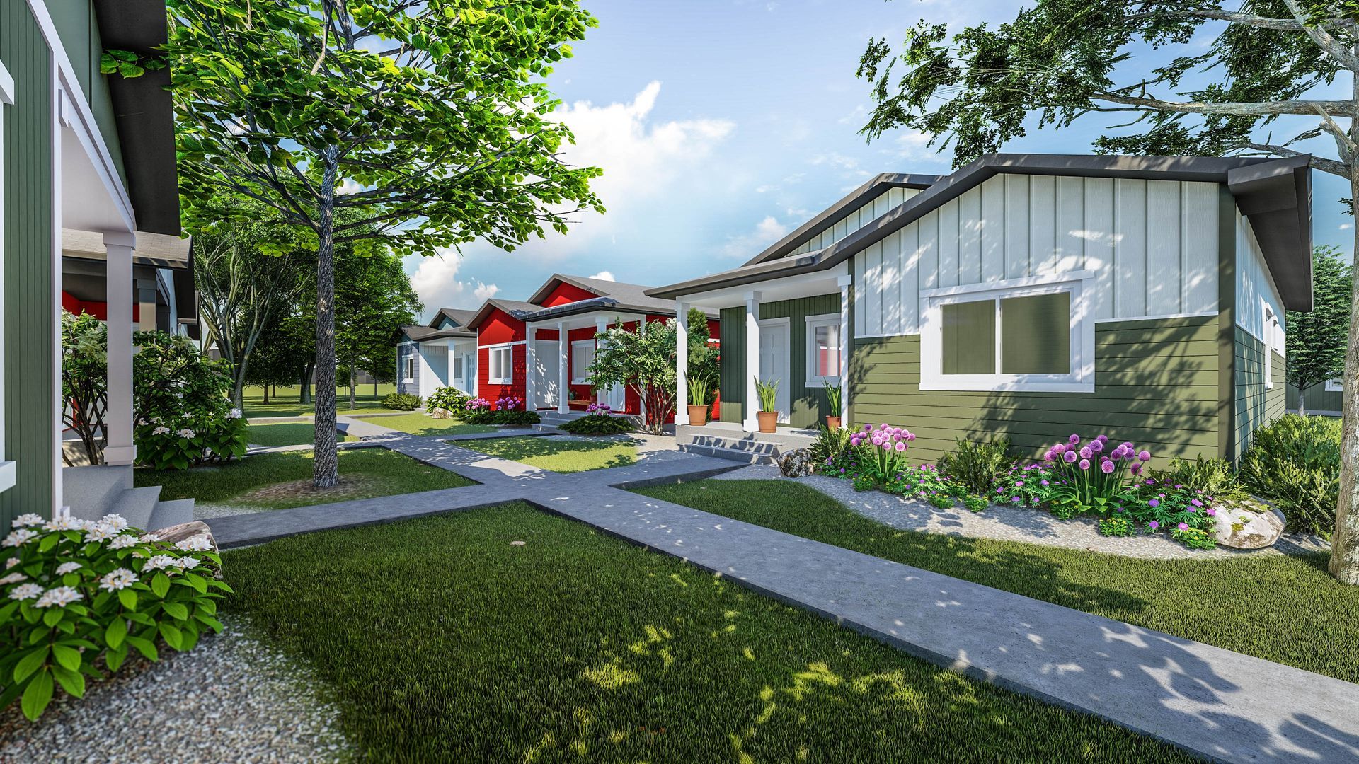 Sunny residential courtyard with gray homes, red accents, and landscaped walkways.