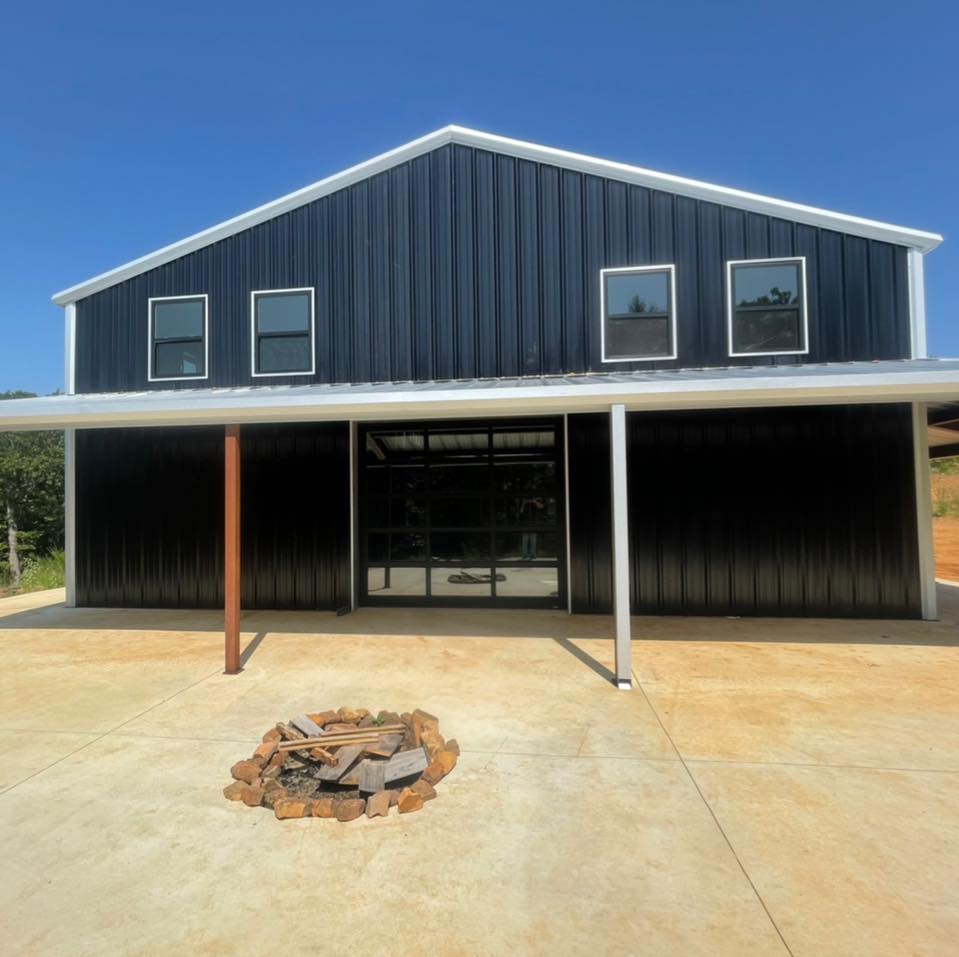 House With Black Garage Door — Okmulgee, OK — Kingdom Door Company