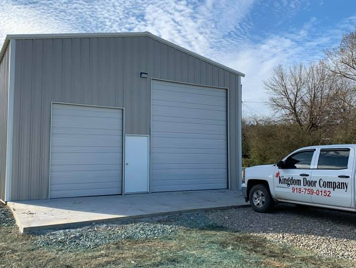 House With White Garage Door — Okmulgee, OK — Kingdom Door Company