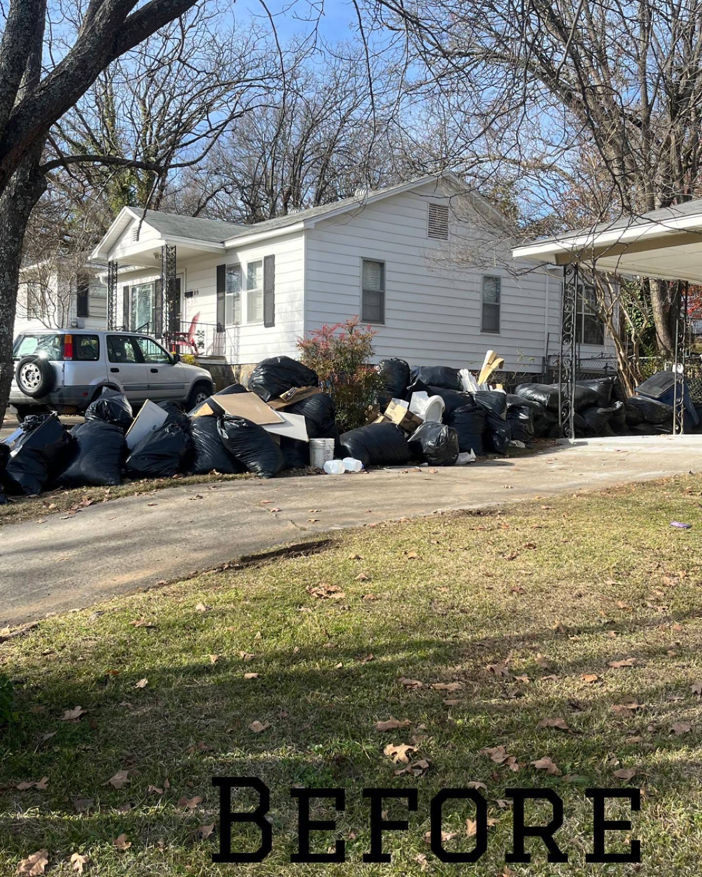 Before photo, showing several trashbags outside a home.