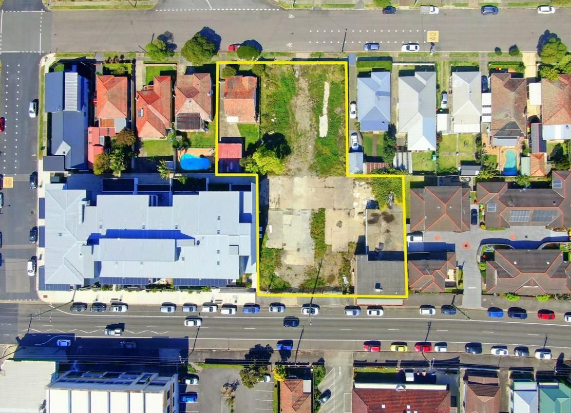 An Aerial View of A Residential Area with Lots of Houses — Duggan Mather Surveyors in Taylors Beach, NSW