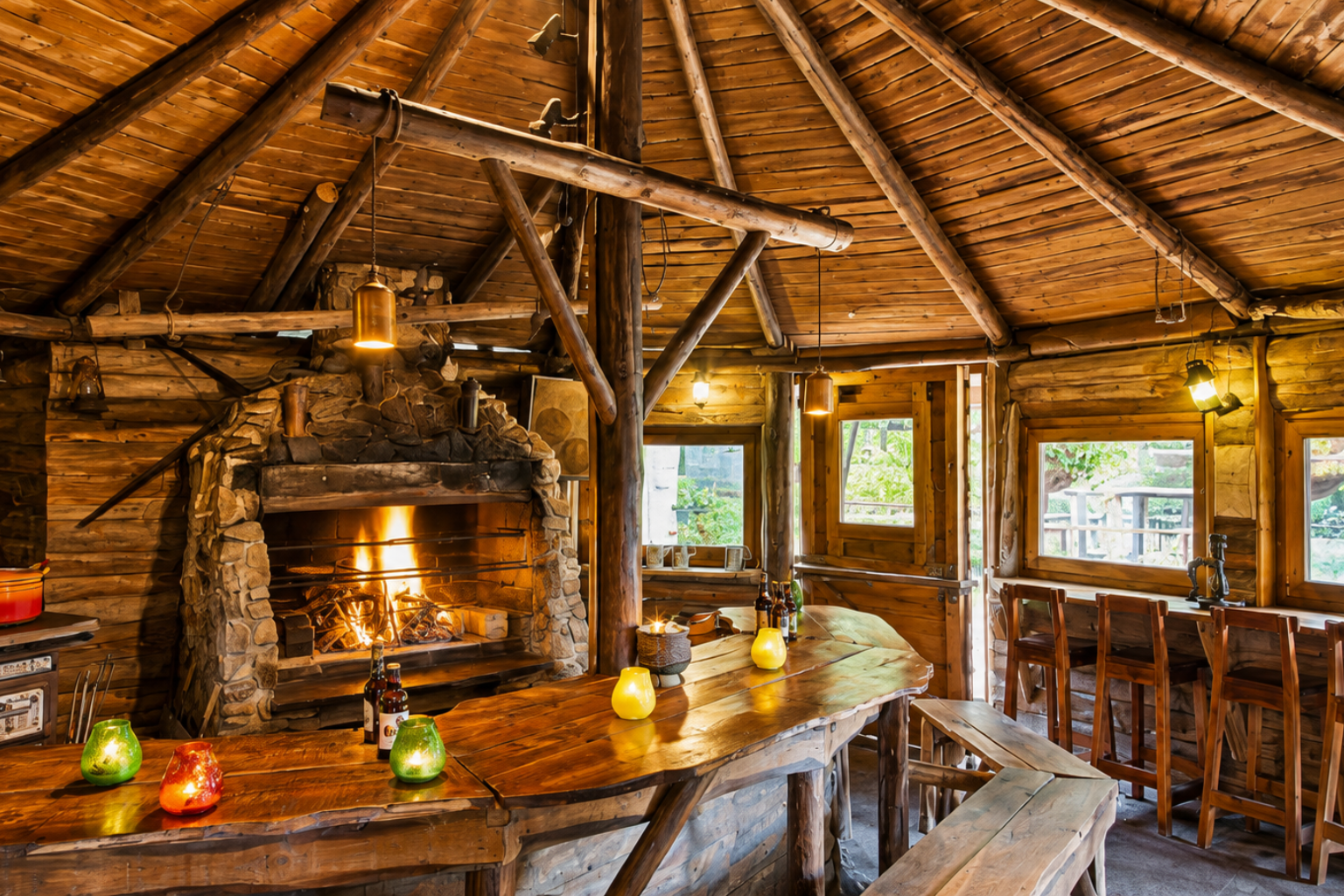 Groepsaccomodatie ardennen met sauna Een houten sauna met een emmer en een lamp aan de muur.