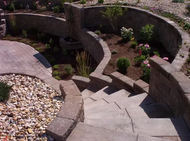 A stone wall with stairs leading up to it