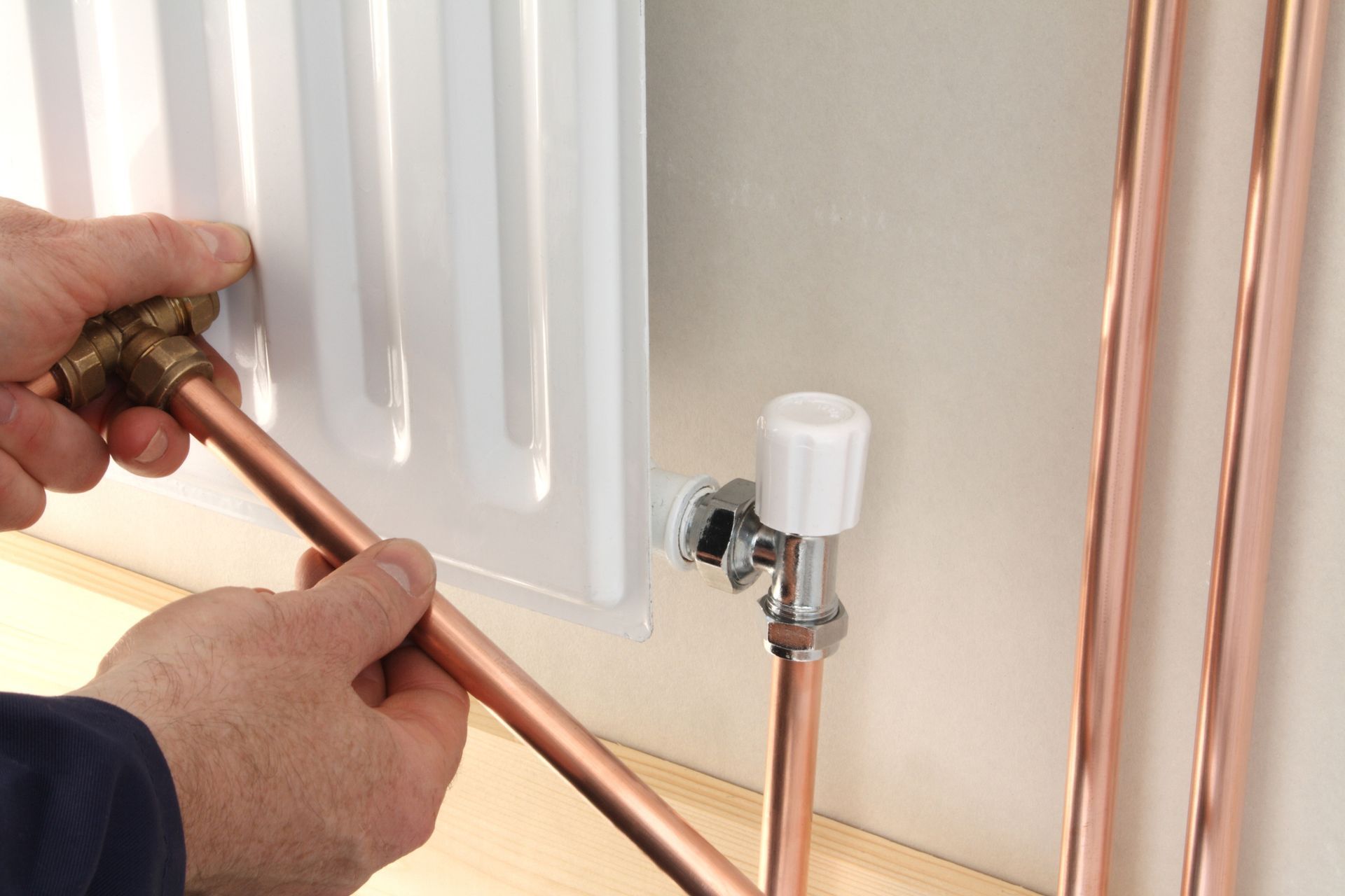 Plumber Installing a New Radiator — Perris, CA — G L Plumbing & Mechanical Plumber Installing a New Radiator — Perris, CA — G L Plumbing & Mechanical