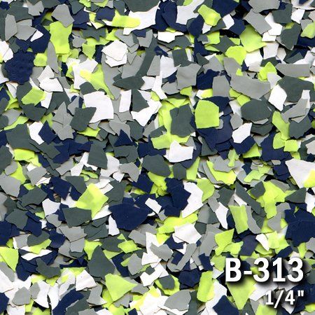 Close-up of multicolored epoxy floor flakes: white, navy, lime green, and gray. Labeled B-313, 1/4