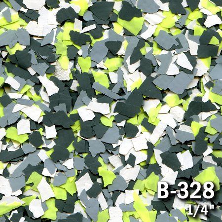 Chips of floor coating material in gray, green, and white.