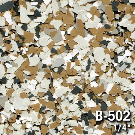Close-up of a speckled floor coating, featuring tan, white, and gray flakes, labeled 