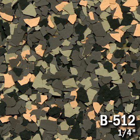Close-up of camouflage-colored epoxy floor flakes, including shades of green, tan, and dark gray.