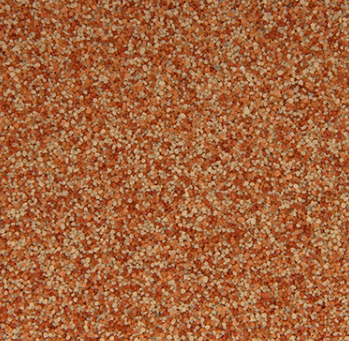 Close-up of a speckled orange and tan textured surface.