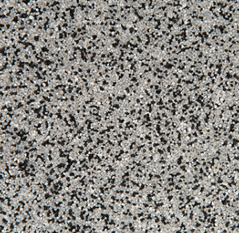 Gray speckled surface with small black and white granules.