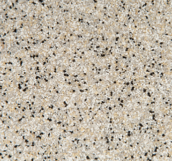 Tan speckled surface with small black flecks.