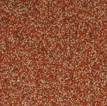 Close-up of a textured red and light brown surface, likely gravel or stucco.